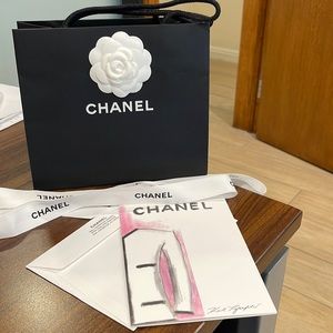 Chanel bag, flower, ribbon, & card